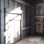 Using reclaimed lumber to restore an old barn and maintain its original charm